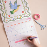 Wall calendar showing UK and US holidays week numbers and moon phases