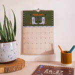Close up of A4 academic calendar printed on recycled paper with bronze wire binding
