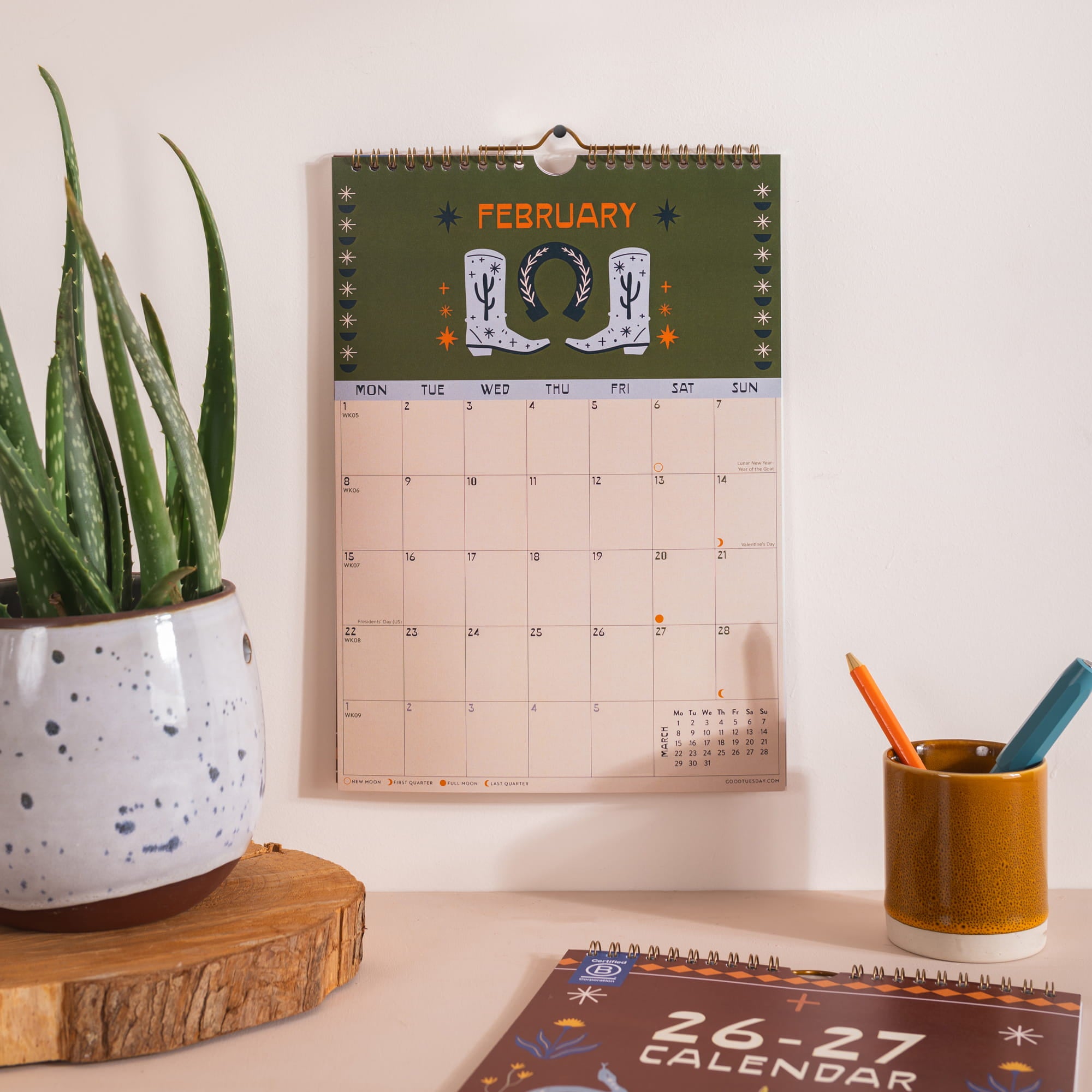Close up of A4 academic calendar printed on recycled paper with bronze wire binding