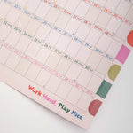 Calendar with colorful design and motivational quote on a white background