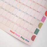 Calendar with colorful design and motivational quote on a white background