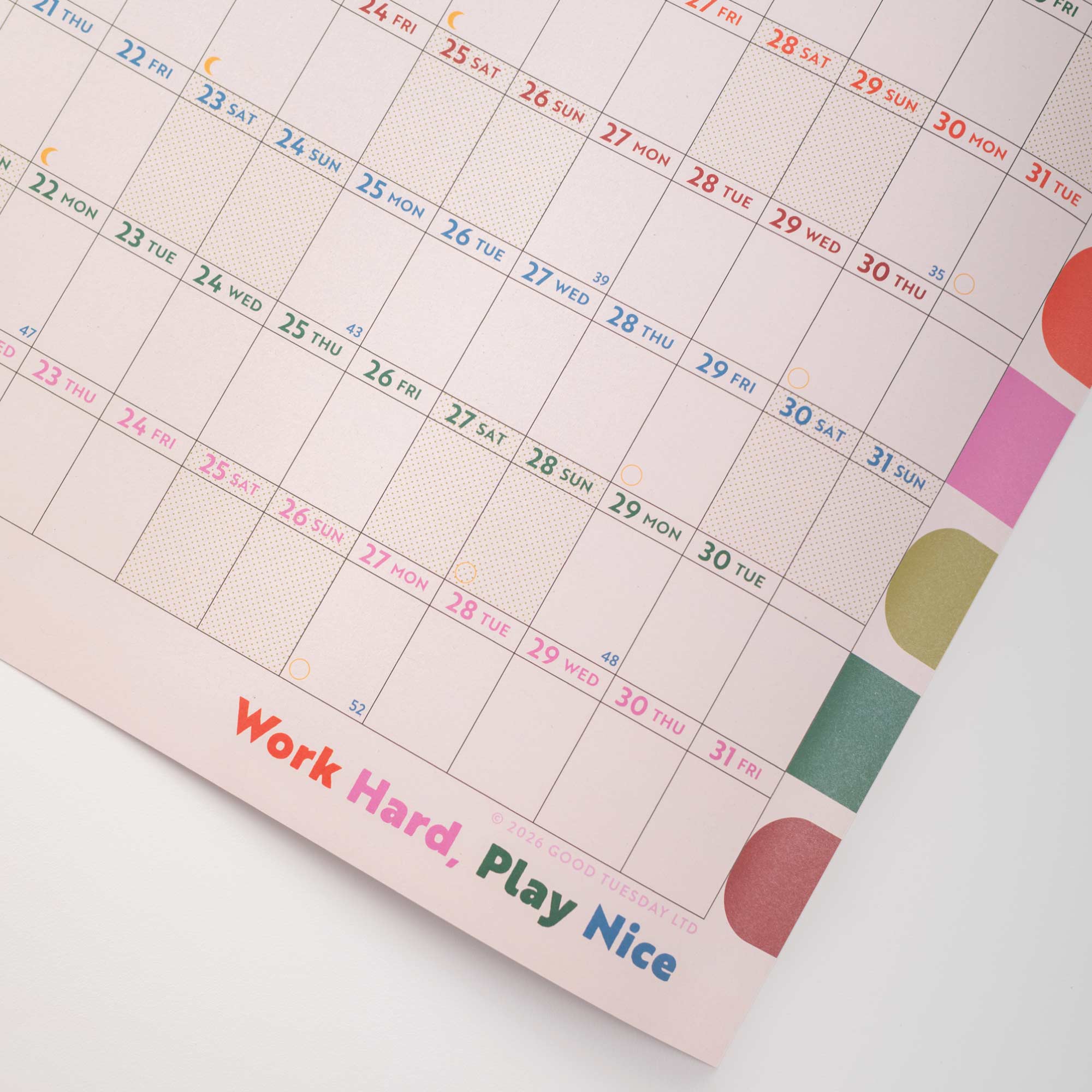 Calendar with colorful design and motivational quote on a white background