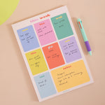 A4 Bright Side Weekly Planner Pad shown on a desk alongside stationery