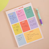 A4 Bright Side Weekly Planner Pad shown on a desk alongside stationery