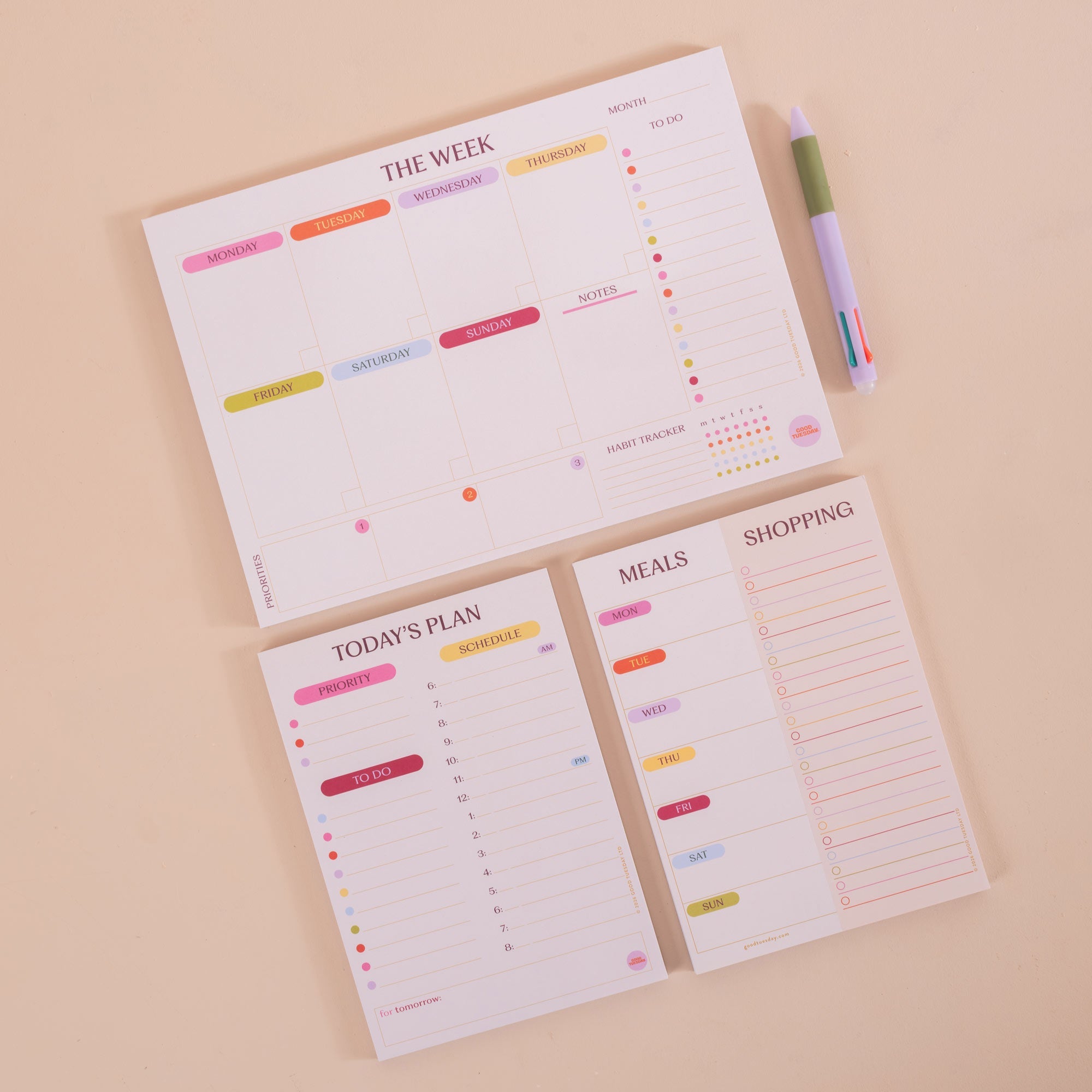 A4 Colour Theory Weekly Planner Pad shown on a desk alongside stationery
