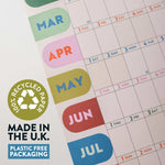 Calendar with colorful month labels and a recycling logo on recycled paper, made in the U.K.