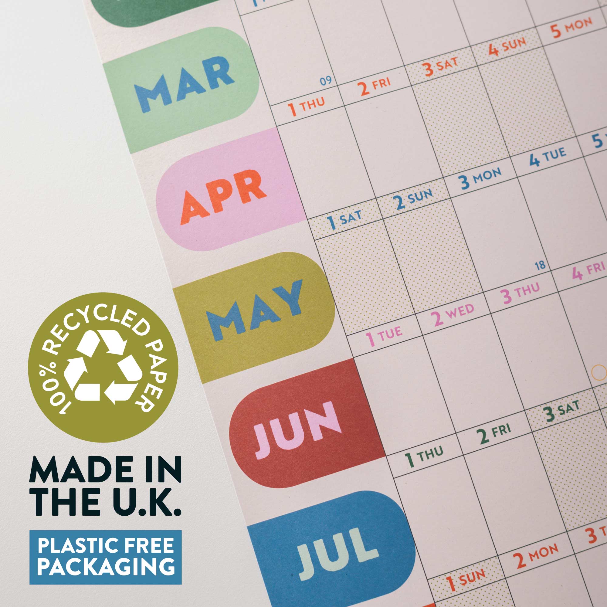 Calendar with colorful month labels and a recycling logo on recycled paper, made in the U.K.