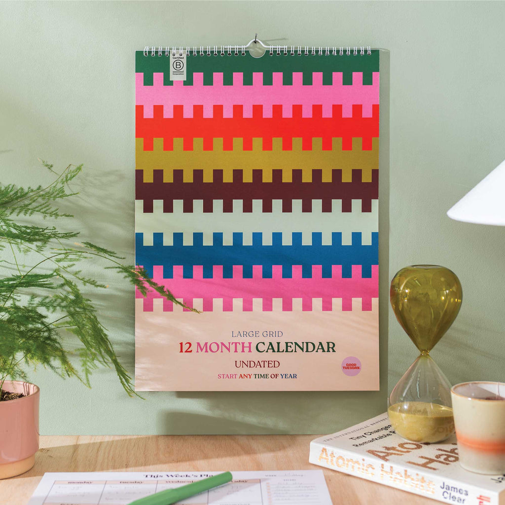 Large A3 undated 12-month wall calendar with bold colourful design, perfect for flexible year-round planning. Printed on 100% recycled paper with a large grid layout.