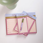 Set of three notepads with different uses on a white surface