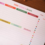 Close-up of date rows and task sections on planner pad