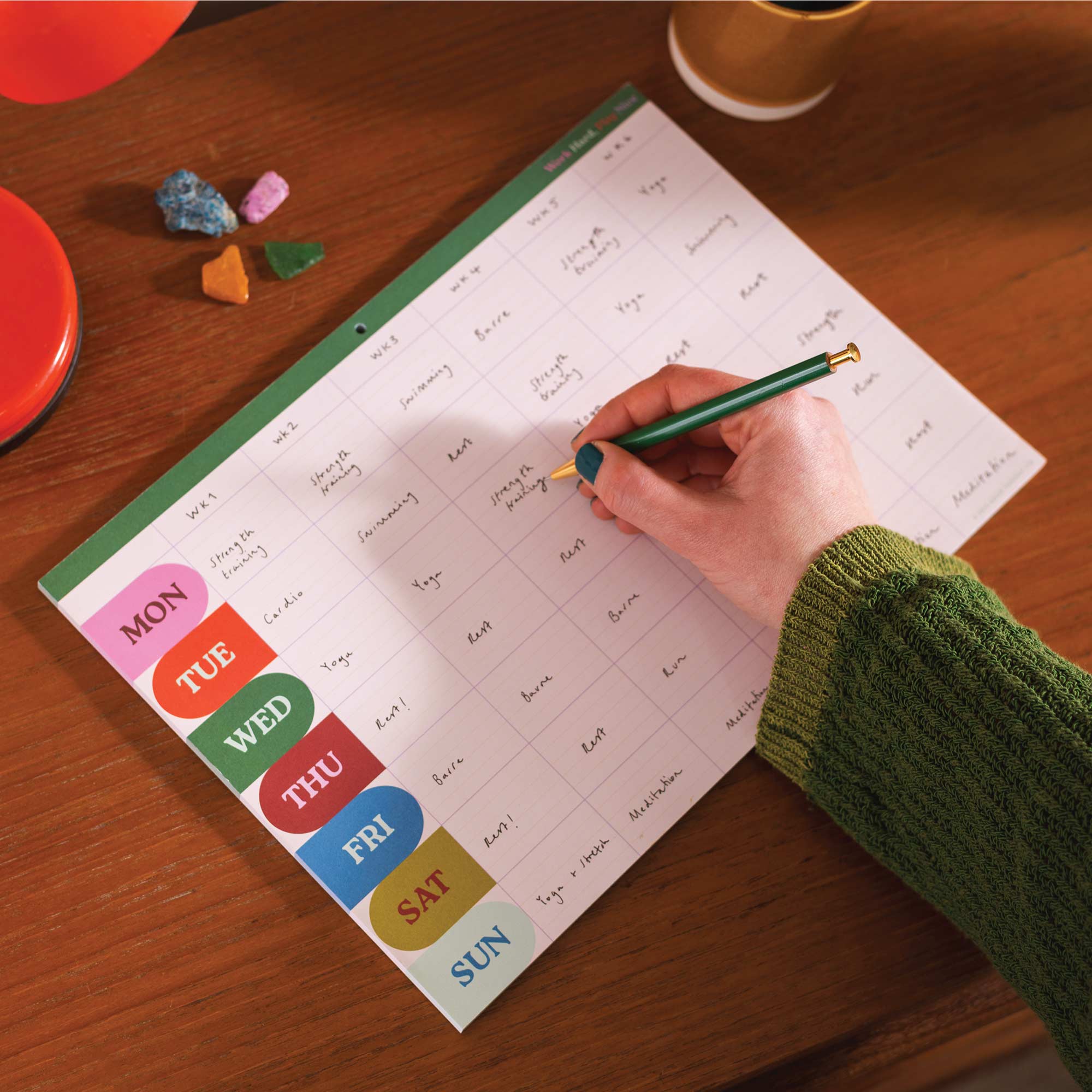 Tear-off planner pad with weekly layout and monthly overview