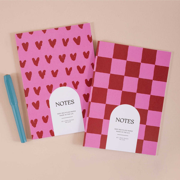 Set of two A5 lined notebooks with red heart and burgundy checkered covers – recycled paper stationery, pink and red notebook duo, eco-friendly writing journal, 60 lined pages, made in the UK.