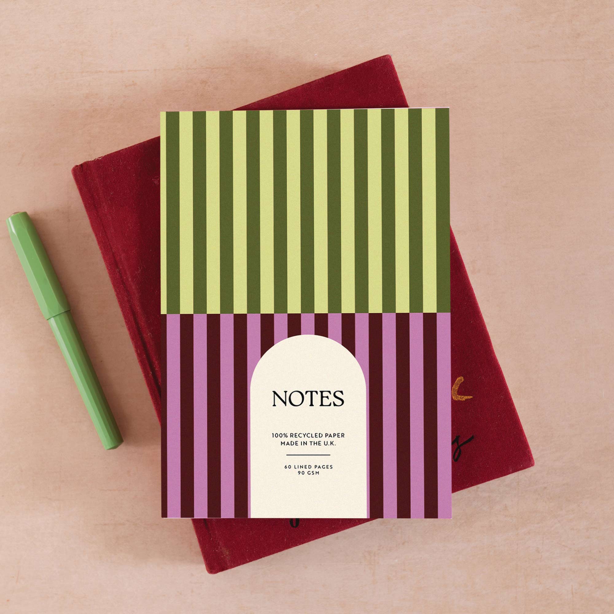 Lined 60 page notebook with pistachio green and plum purple stripe design.