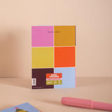 Colorful Christmas Card with a geometric design on a beige background