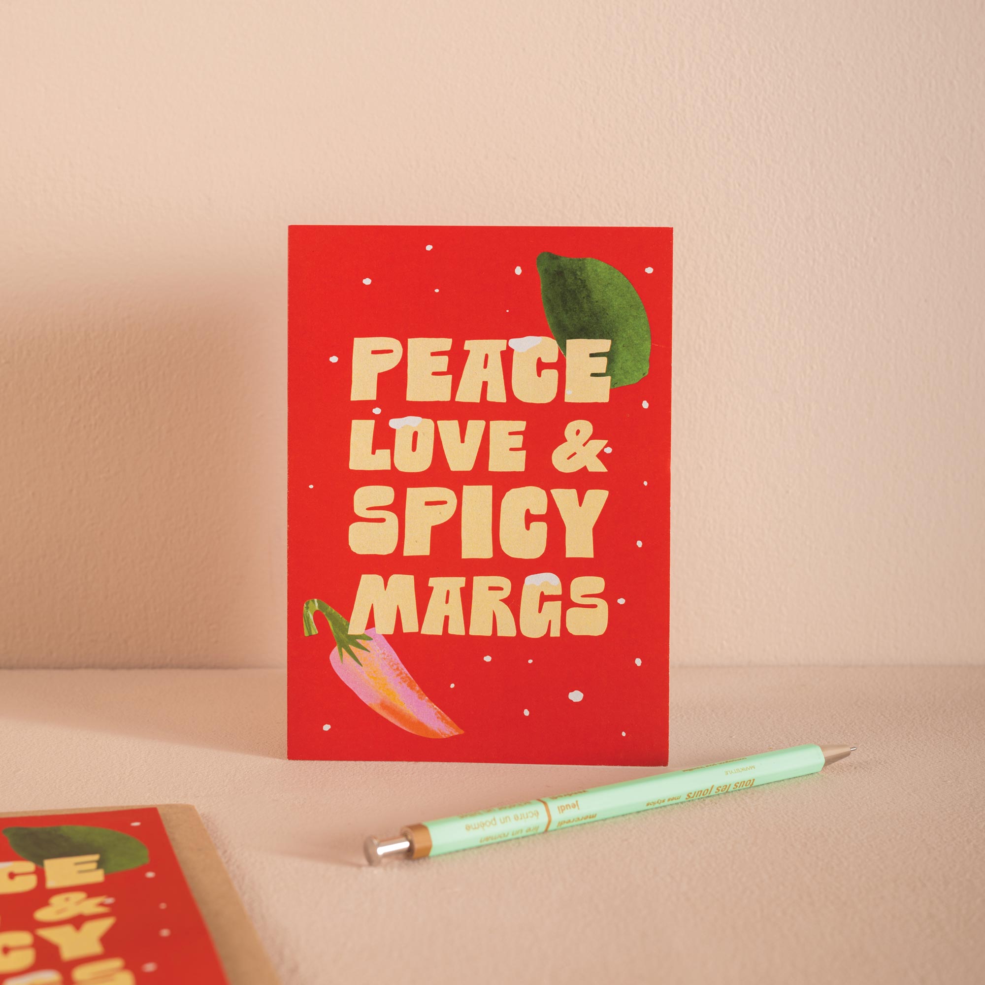 Red Christmas card with 'Peace Love & Spicy Margs' text.