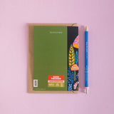 Birthday card with a colorful mushroom design on the cover and a blue pen on a pink background