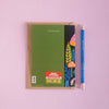 Birthday card with a colorful mushroom design on the cover and a blue pen on a pink background