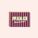 Greeting card with purple and pink striped design and 'Merci beaucoup' text on a white background