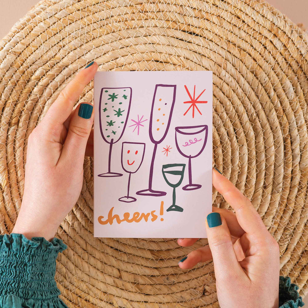 Cheers celebration card, clinking glasses card, all-occasion card, celebration greeting card, eco-friendly stationery, recycled card UK, new job congratulations card, stylish hand-drawn design card