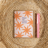 Trip around the sun birthday card, sunbeam birthday card, bold sun design card, eco-friendly birthday card UK, modern greeting card, recycled card, adventure-themed birthday card.