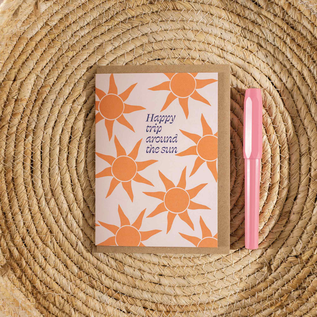 Trip around the sun birthday card, sunbeam birthday card, bold sun design card, eco-friendly birthday card UK, modern greeting card, recycled card, adventure-themed birthday card.