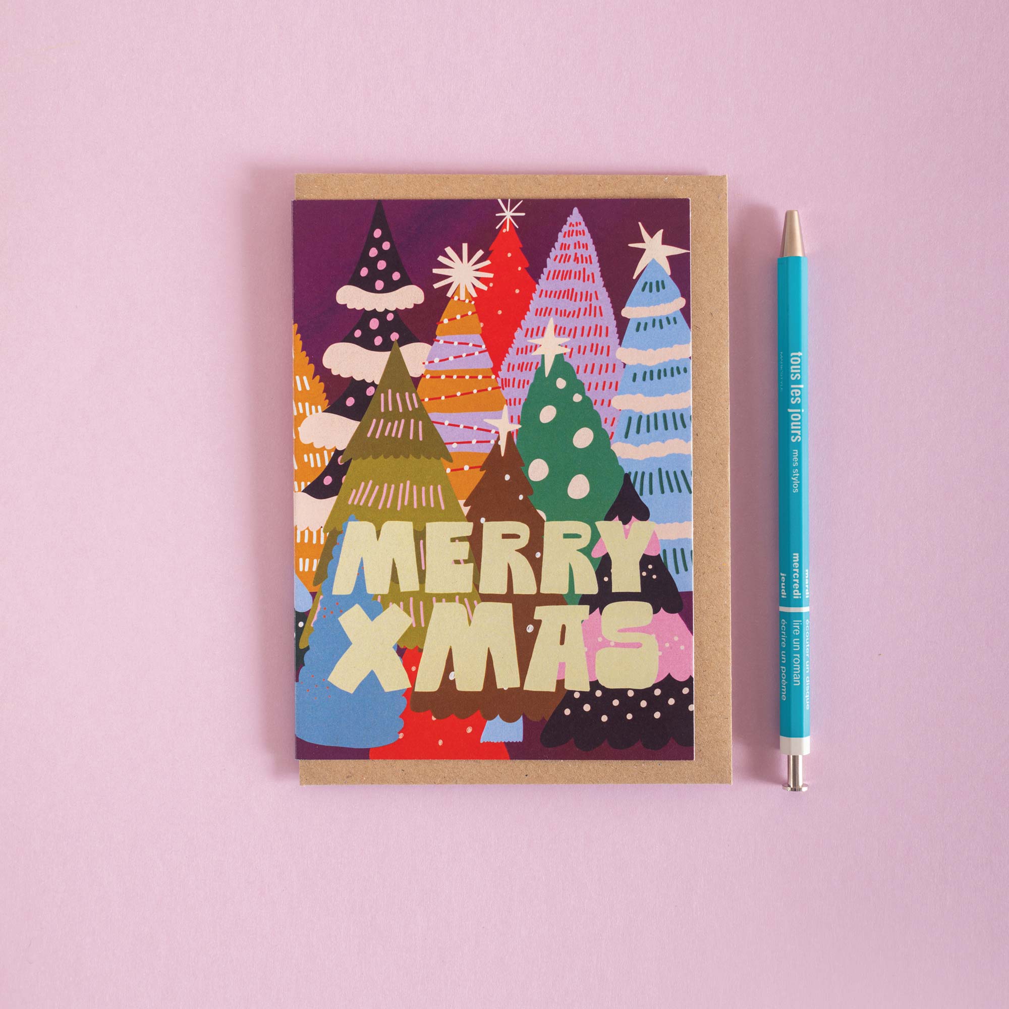 Christmas card with colorful Christmas tree design and 'Merry Xmas' text 