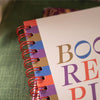 Detail of the spiral binding on the Book Vibe Reading Journal, allowing it to lay flat for easy writing.