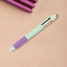 Turquoise multiclick erasable pen on a beige surface with a striped object in the background.