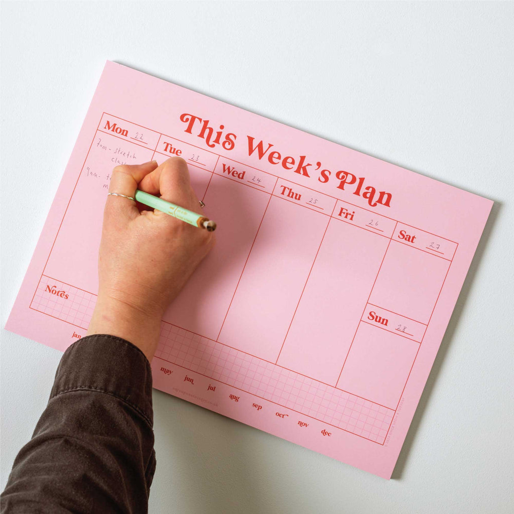 a4 vertical weekly planner in pink and red. 100% recycled paper. made in the UK.