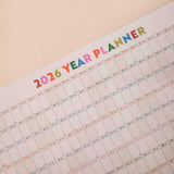 close up of 2026 wall planner showing highlighted weekends, moon phases, nd week numbers