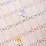 close up showing 2026 wall planner in use, with writing and stickers