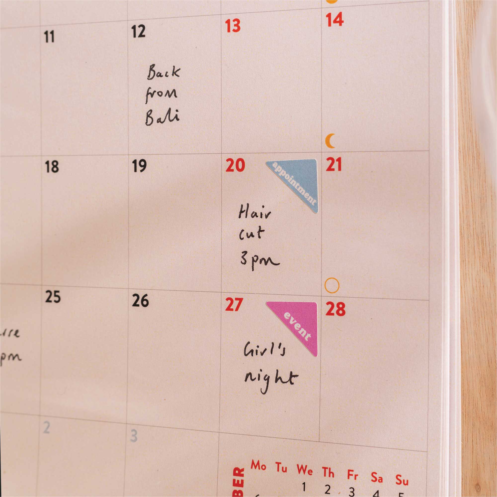 Close-up of monthly layout in the 2025–2026 Simply Bright A4 Wall Calendar, showcasing week numbers, UK & US holidays, and moon phases