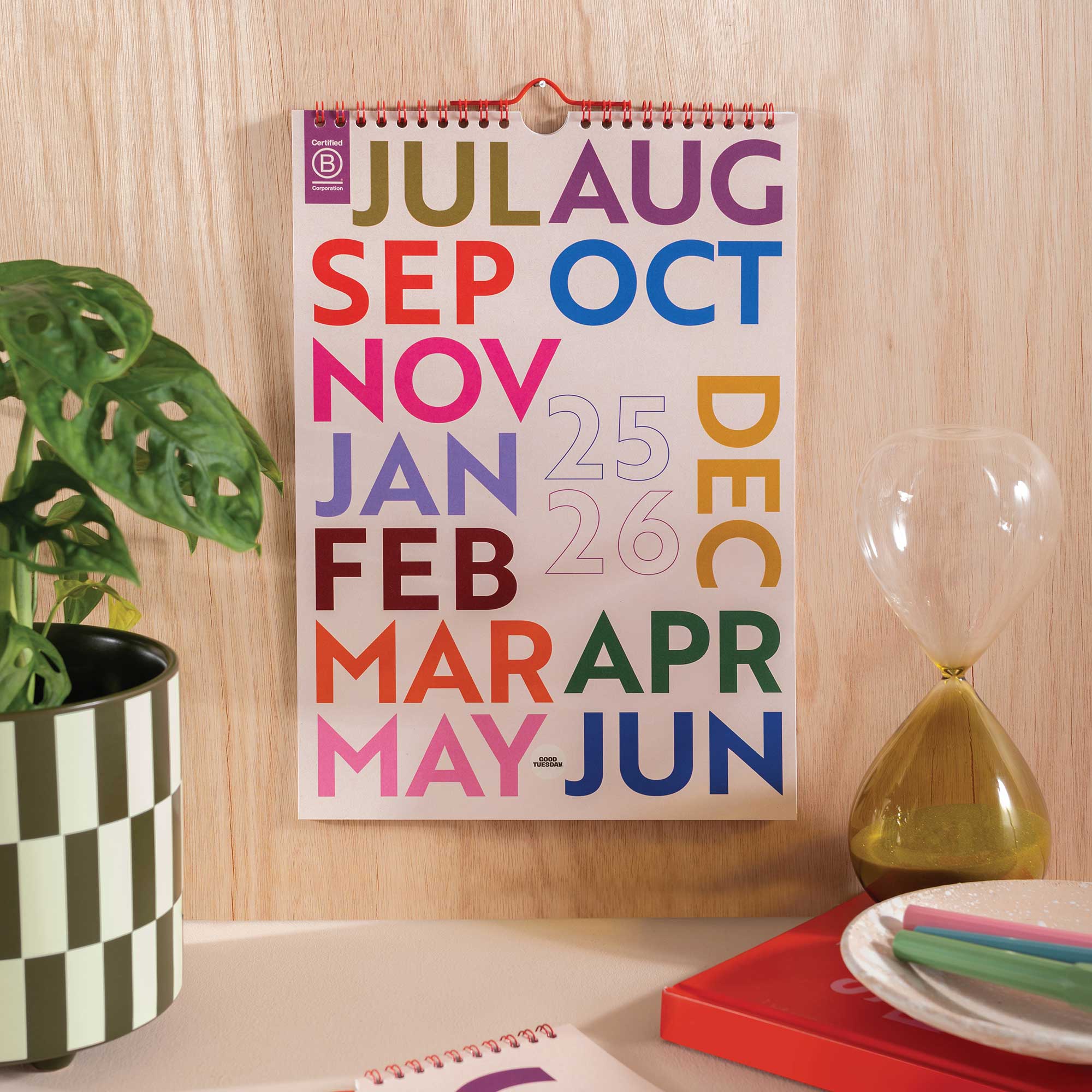 Front cover of the 2025–2026 Mid-Year A4 Wall Calendar – Simply Bright design with bold, colourful abstract artwork, printed on 100% recycled paper