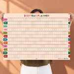 2027 year wall planner in contrasting retro-inspired colours with a large grid for writing. Modern design calendar