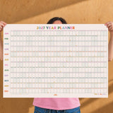2027 year planner in landscape format with coloured heading font. Dated calendar grid for writing on. 