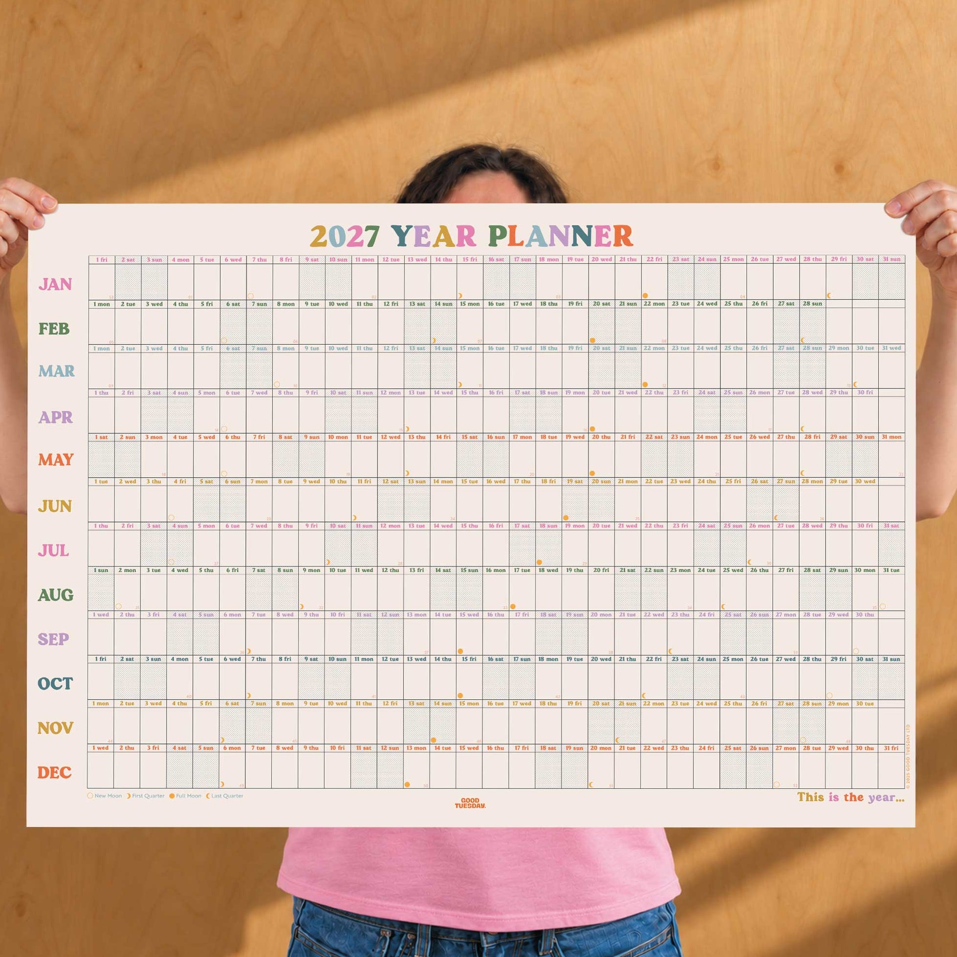2027 year planner in landscape format with coloured heading font. Dated calendar grid for writing on. 