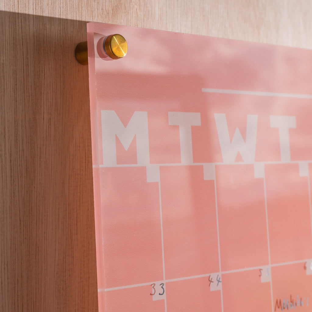 A3 portrait wipeable acrylic weekly planner in peach. 100% Greencast Recycled Acrylic. Design and printed in the UK.