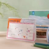 2025–2026 Ocean Tidal Waves Desk Calendar displayed on a desk, illustrating its practical use in a workspace setting