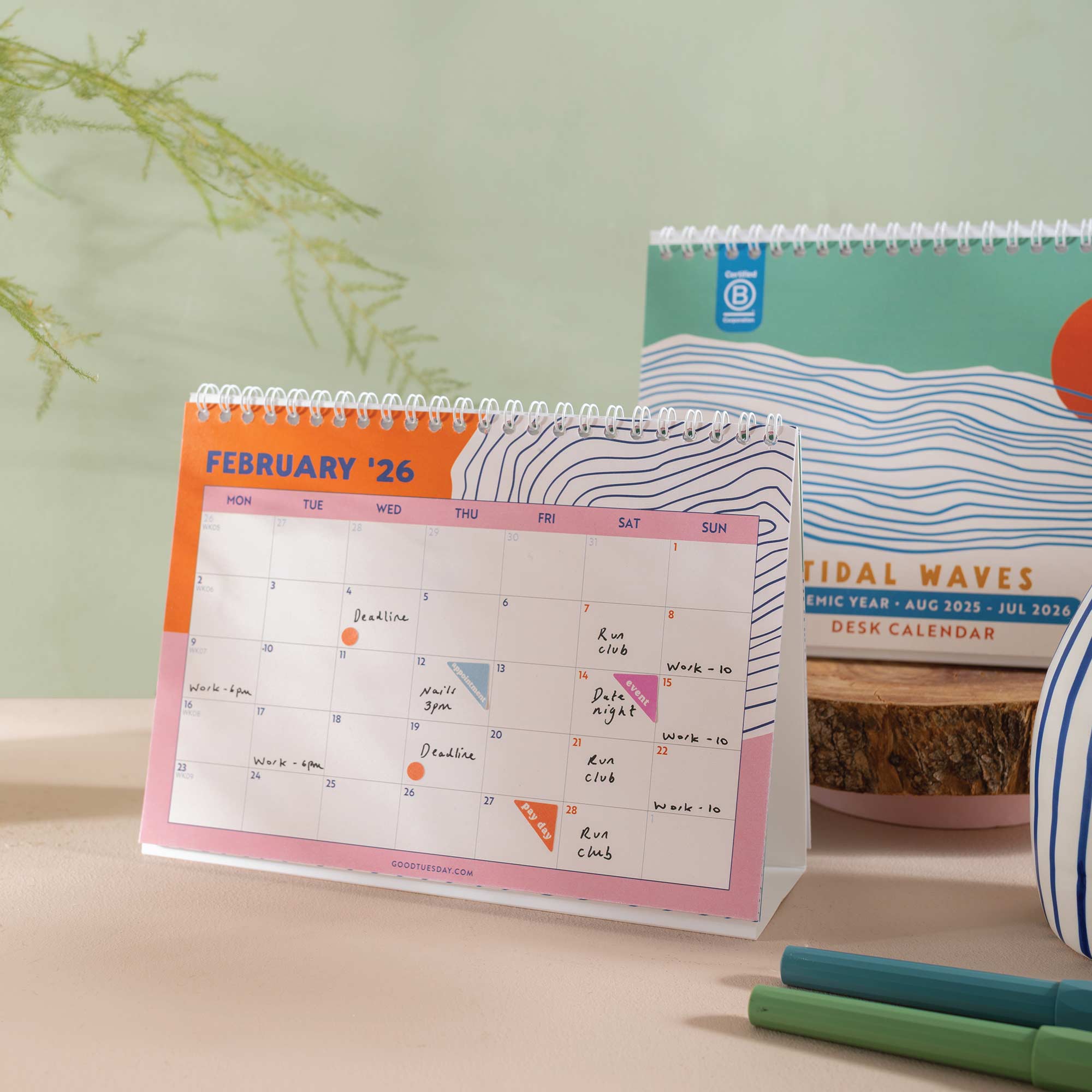 2025–2026 Ocean Tidal Waves Desk Calendar displayed on a desk, illustrating its practical use in a workspace setting