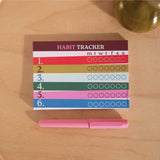 A6 weekly habit tracker pad in bold Work Hard Play Nice design