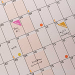 2026 wall calendar in use with writing and stickers