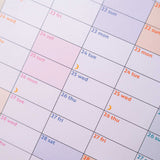 Year-at-a-glance planner with weekends and moon phases subtly highlighted