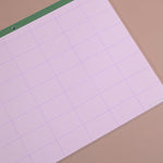Close-up of recycled paper planner pad with colour-block sections