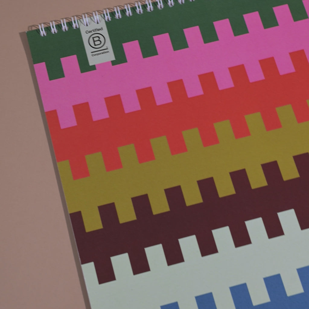 Large A3 undated 12-month wall calendar with bold colourful design, perfect for flexible year-round planning. Printed on 100% recycled paper with a large grid layout.