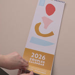 Video showing 2026 Couples Calendar, oranges, reds and peach colour scheme. 