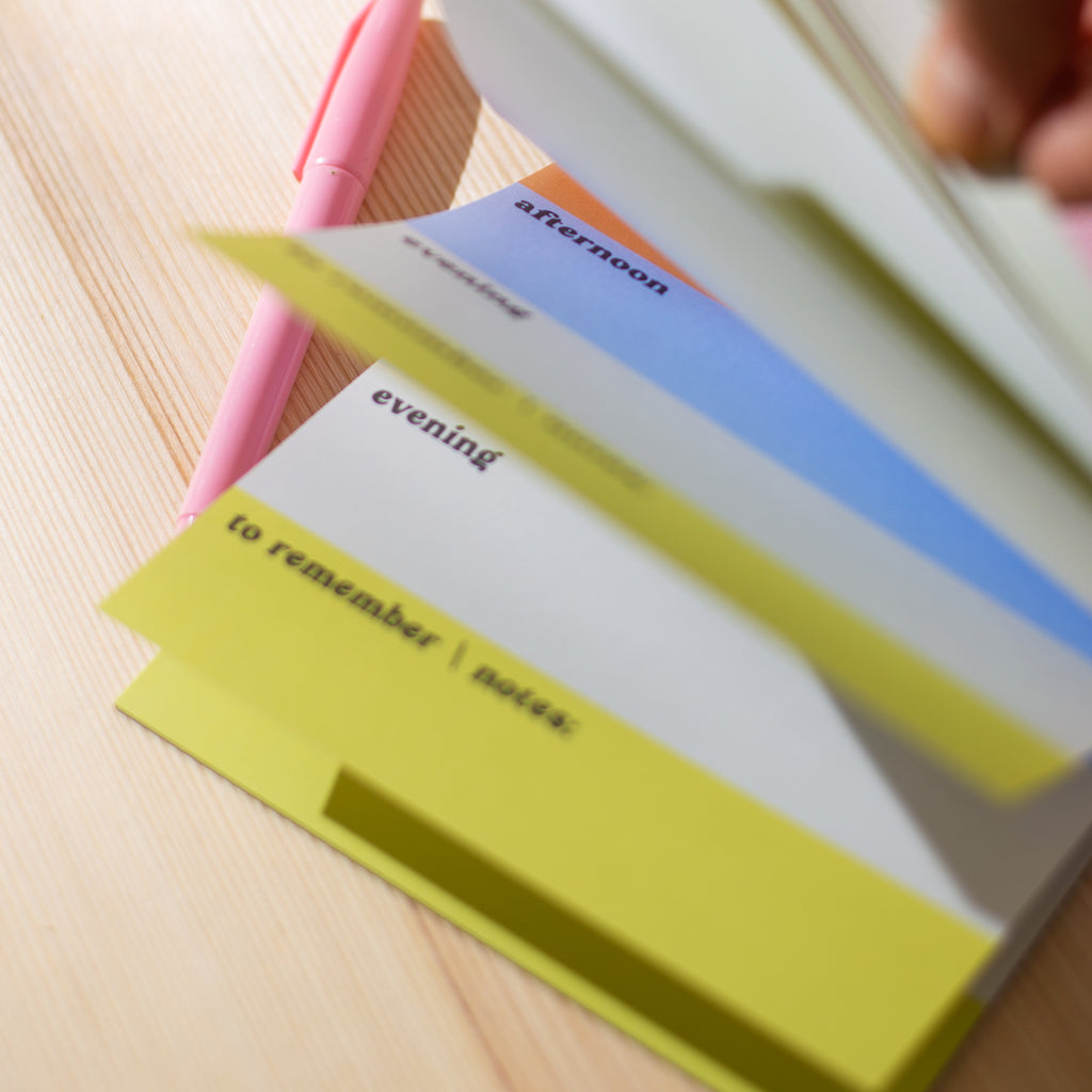 A5 Daily Planner Pad in Rainbow Colour Block. This time blocking style desk pad helps organise your day with ease. 100% Recycled Paper. Made in the UK. ADHD daily planner.